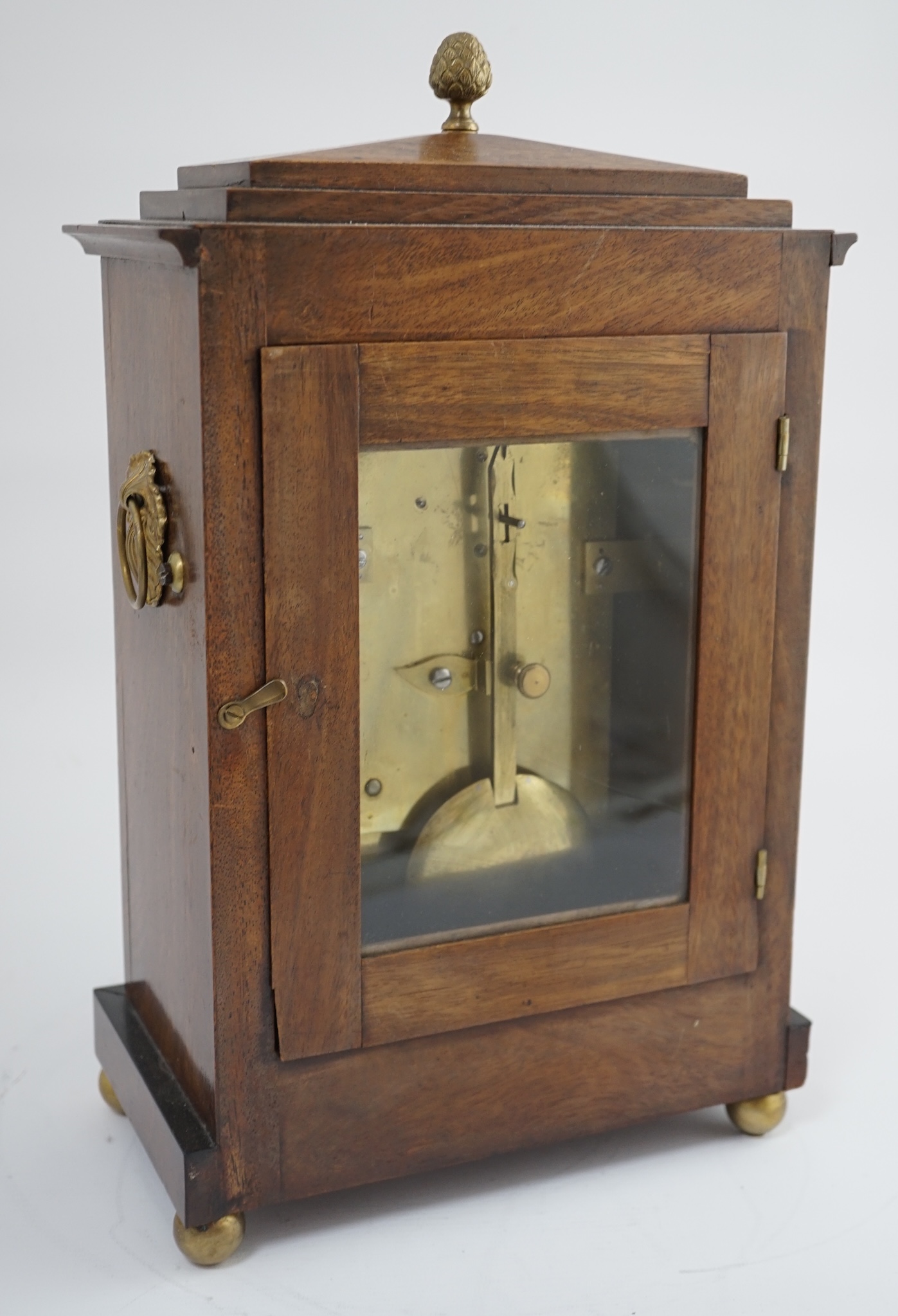 Webster of London. A Regency brass inset and ebonised mahogany bracket timepiece